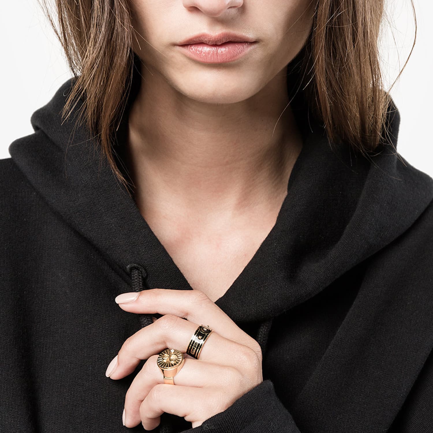Foundrae signet ring worn on a model's hand in a jewelry editorial image.